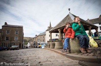 Children eating ice creams in Alston, photo by Tony West, courtesy of the Cumbria Photo Library