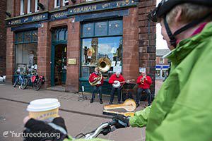 Cyclist outside JJ Grahams photo courtesy of the Nurture Eden Photo Library