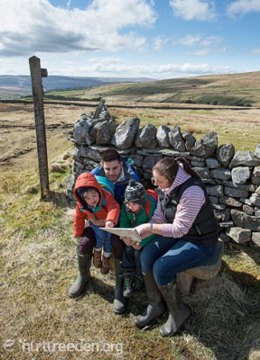 Family looking at map photo by Tony West, courtesy of the Nurture Eden Photo Library