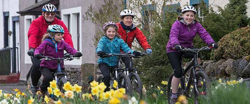 Cycling family photo courtesy of the Nurture Photo Eden Library