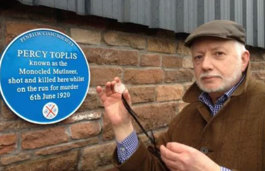 Penrith and Eden Museum curator Dr. Sydney Chapman, with Percy Toplis’s monocle at the unveiling of the commemorative plaque at Plumpton (2015)