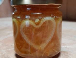 Jar of marmalade with heart-shaped peel inside