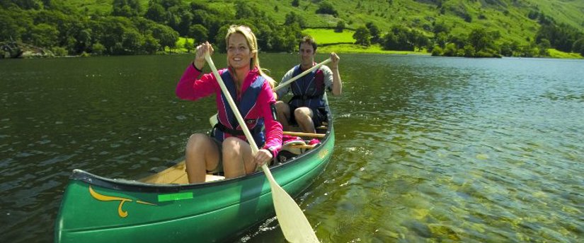 Canoeing couple photo courtesy of the Cumbria Photo Library