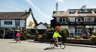 Cyclists in Pooley Bridge photo by Helen Shaw www.malkinphotography.co.uk